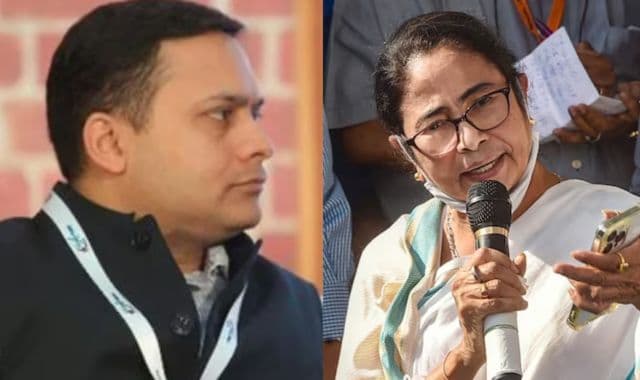 Prime Minister Narendra Modi displays a copy of the ruling Bharatiya Janata Party's (BJP) election manifesto for the general election. (Reuters)