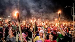 Meira paibis hold torches as they protest against the Tronglaobi killing incident at Khurai, in Imphal on Friday. (Image Credit: ANI Photo)